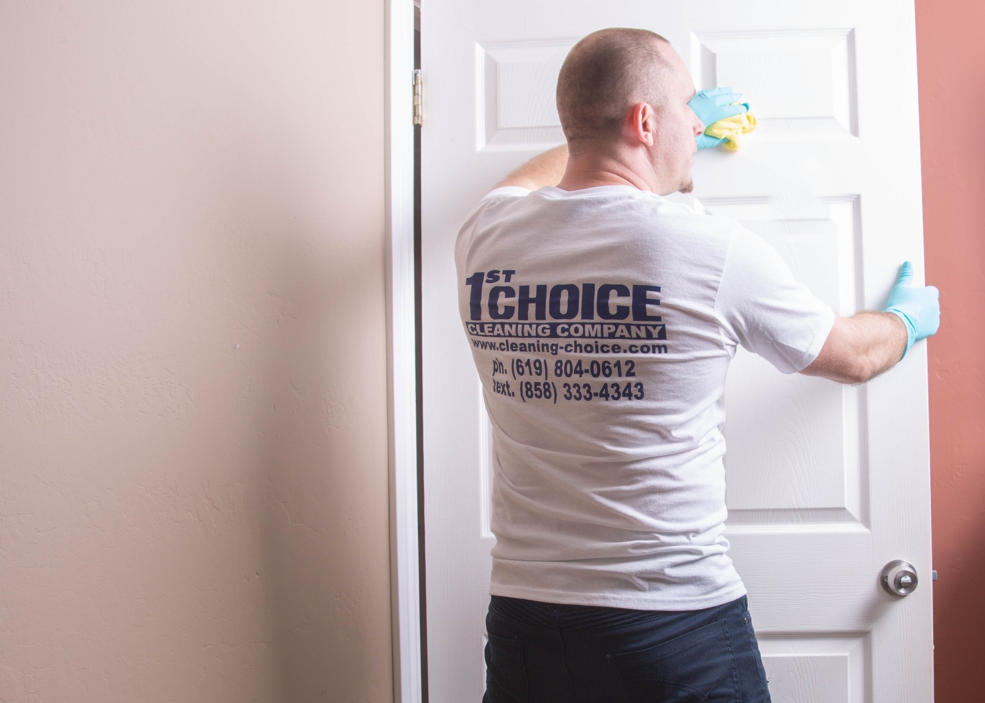 man mopping door